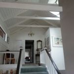Interior vaulted ceiling and trim painting.